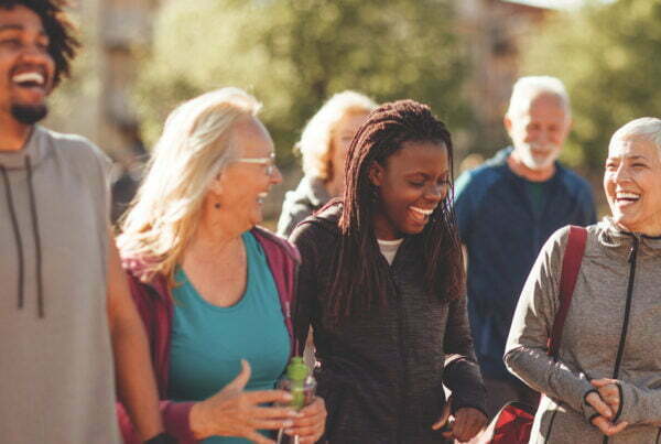 Smiling group of people walking together outdoors