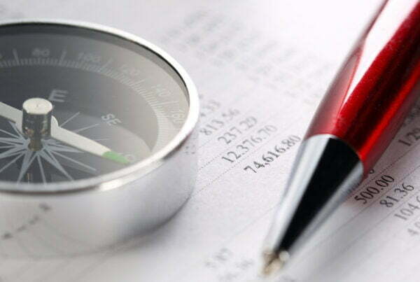 Operating budget, compass and pen